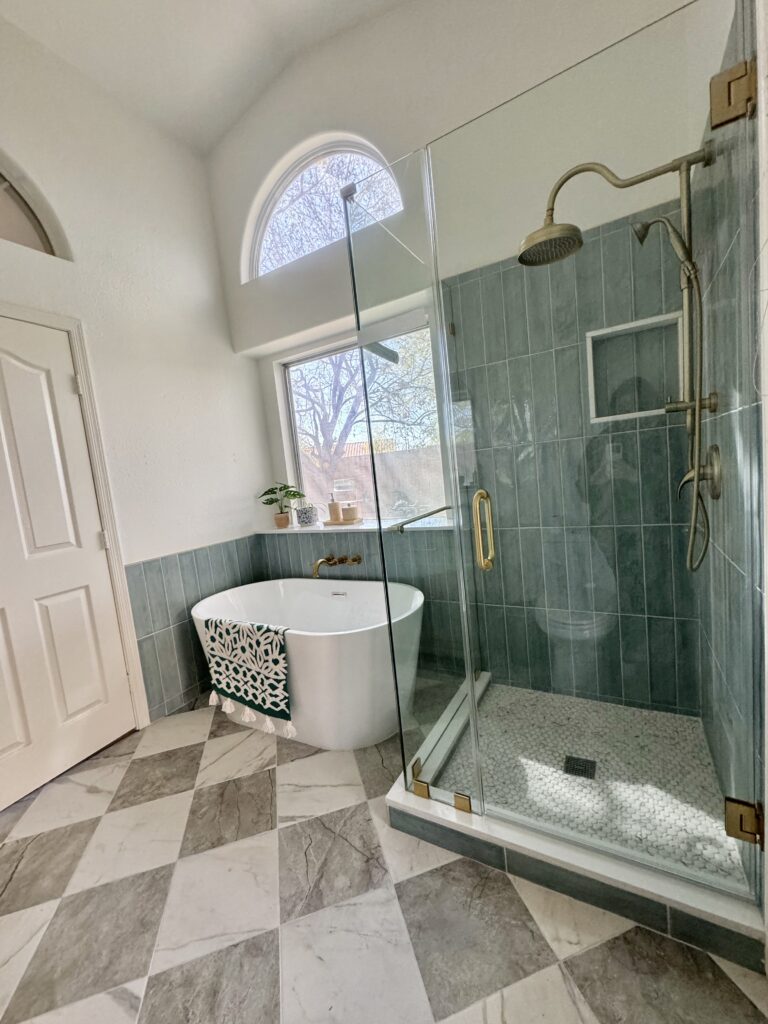 blue-shower-tile-ideas bathroom renovations idea. bathroom remodel with tub. standing tub and shower ideas. blue shower tile. checkerboard bathroom floor.