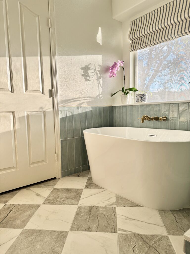 bathroom renovations with tub. bathroom remodel with standing tub. checkerboard floor. checkerboard tile floor. checkered tile floor. affordable checkerboard tile. checkerboard porcelain tile. bathroom with checkerboard floor.