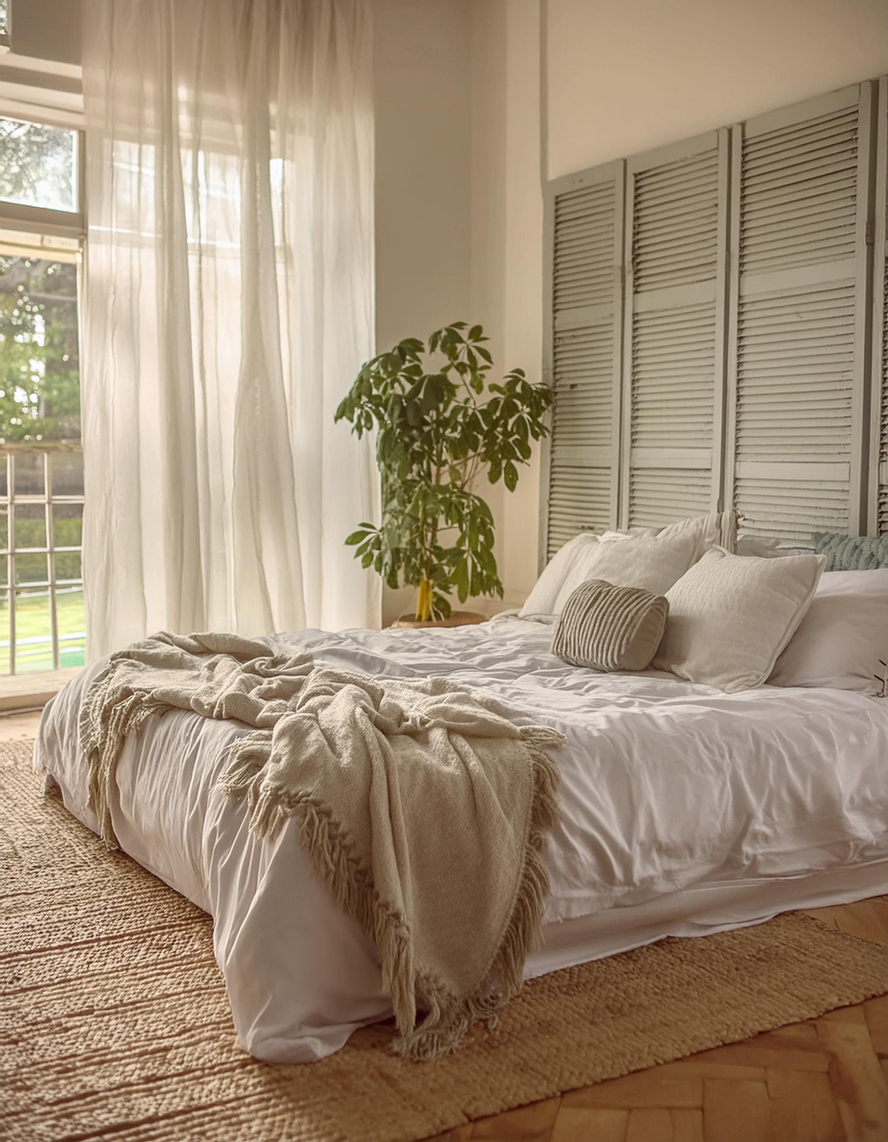 summer bedroom decor. neutral bedroom ideas. rustic bedroom decor. sheer white curtains. bedroom jute rug.