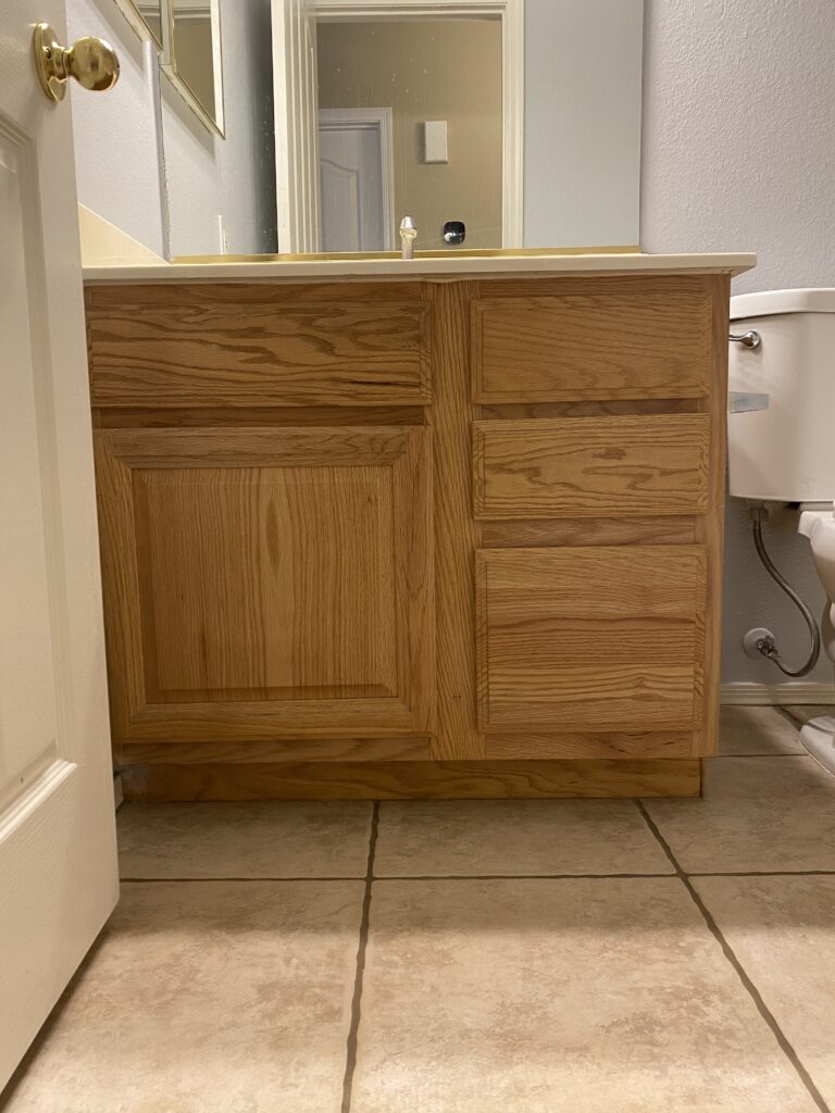 90s builder grade cabinets. 90s oak cabinets makeover. budget friendly bathroom makeover.