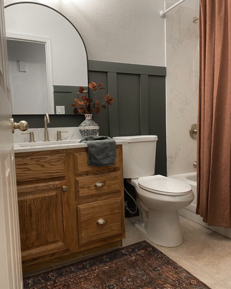 Small Bathroom Makeover. 90s builder grade bathroom remodel. honey oak cabinet makeover. how to update honey oak cabinets. how to update 90s oak cabinets. benjamin moore backwoods. moody green small bathroom. moody green bathroom walls wood cabinets