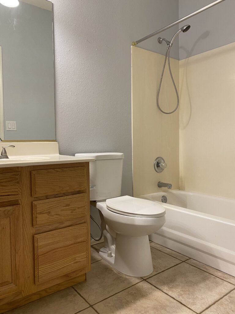 90s builder grade bathroom remodel. honey oak cabinet makeover. how to update honey oak cabinets. how to update 90s oak cabinets. 