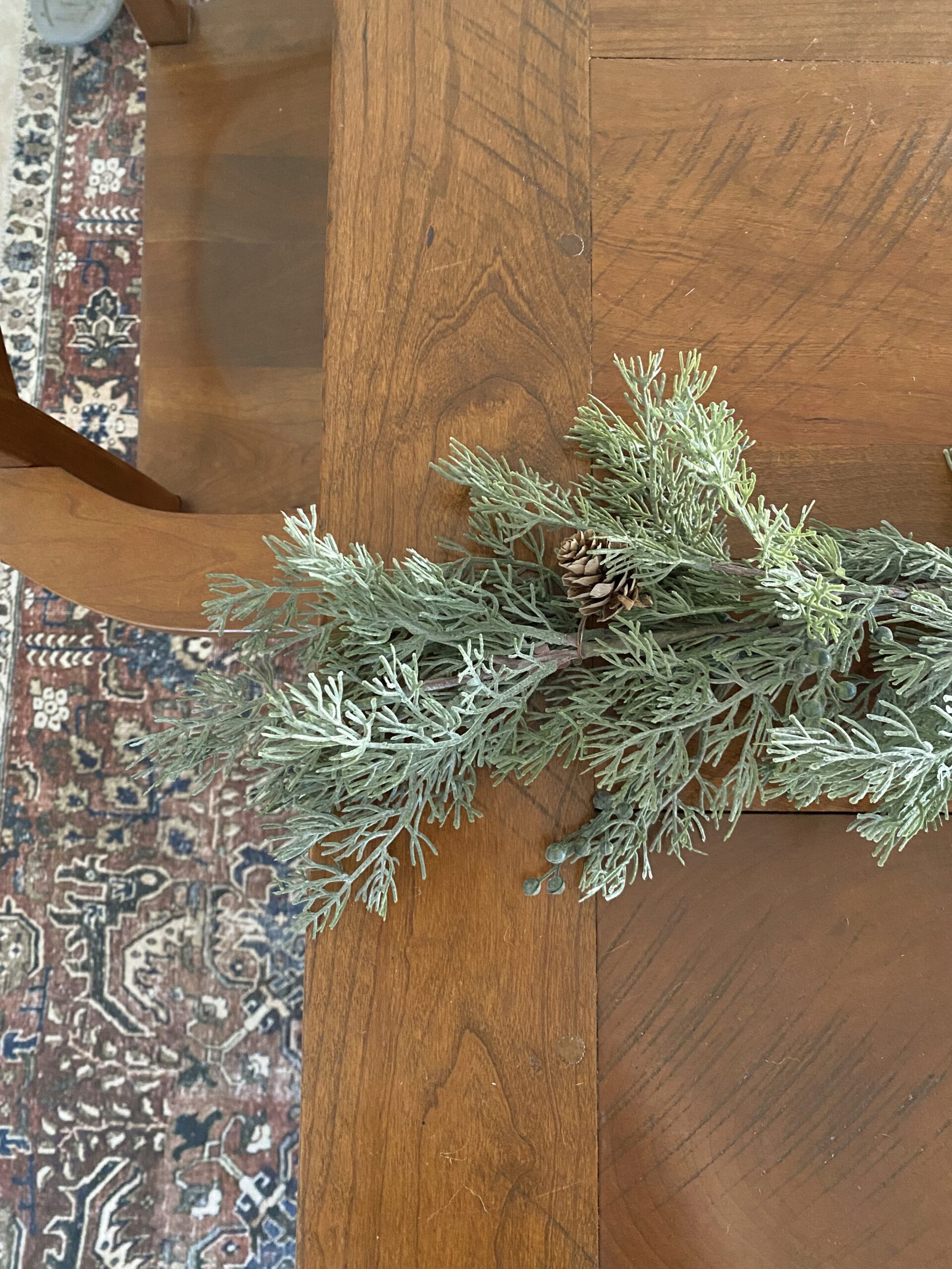 Faux Cedar and Berry Christmas Holiday Garland. christmas garland on dinging table. faux christmas garland review.