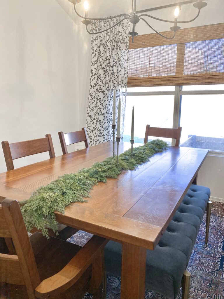 christmas garland review. CraftMore Cedar Garland 6' christmas garland on dinging table. faux christmas garland review.