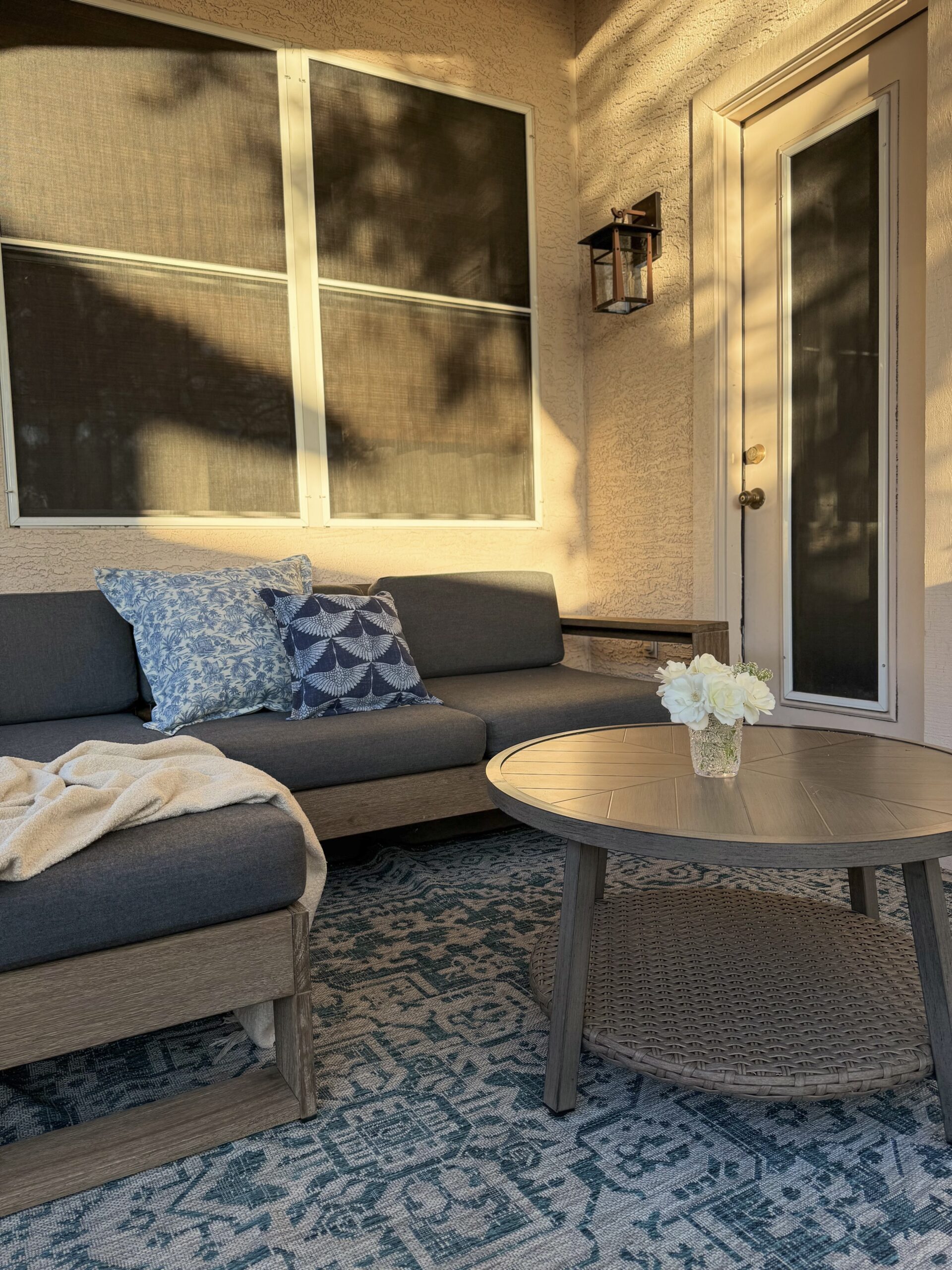 small patio ideas. patio makeover. arizona patio ideas. patio coffee table. blue outdoor area rug.