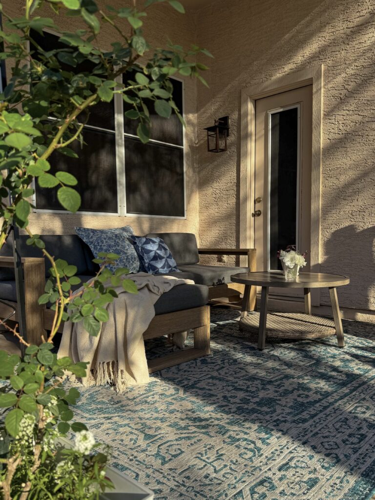 small patio ideas. patio makeover. arizona patio ideas. patio coffee table. blue outdoor area rug.