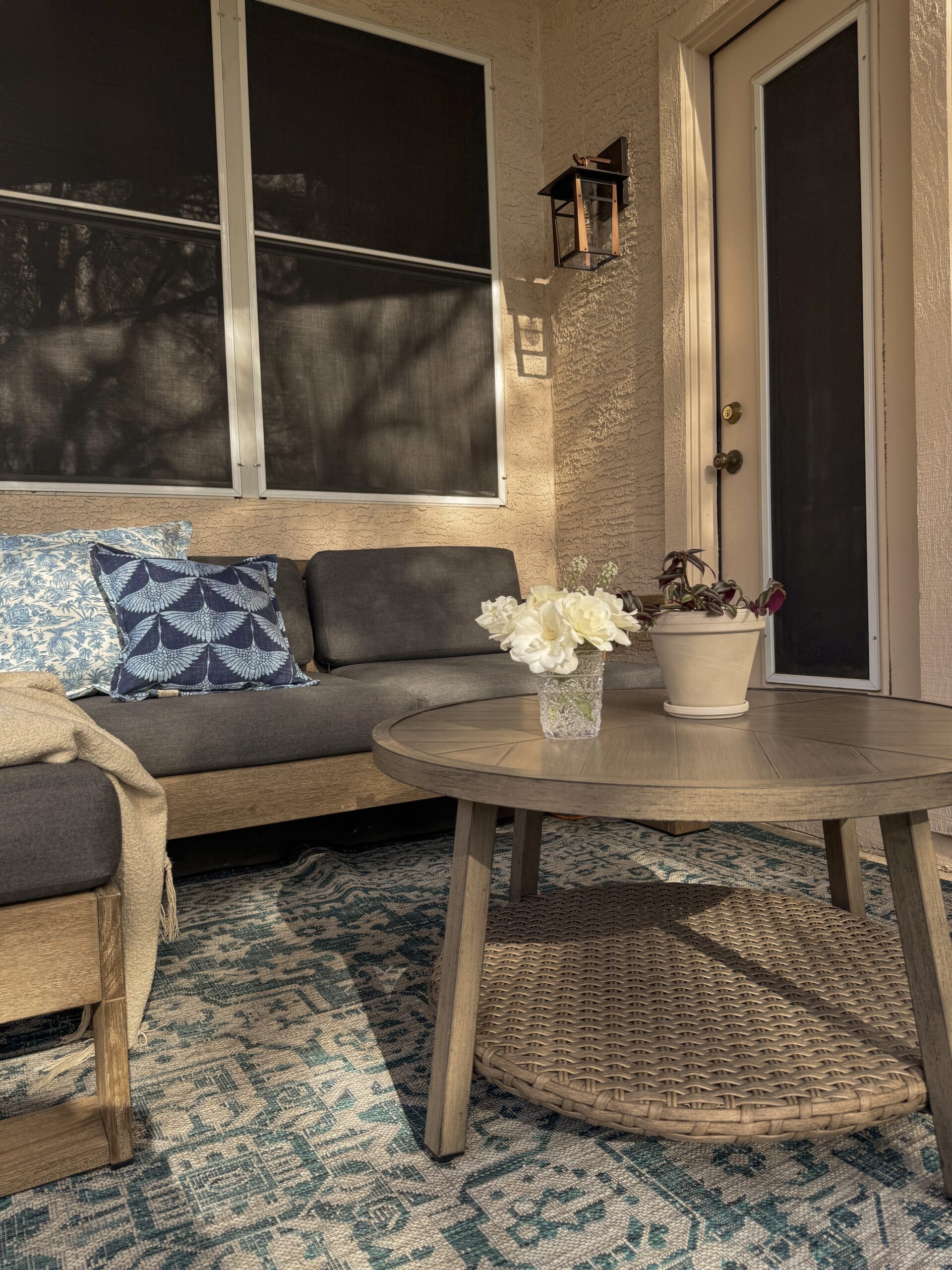 small patio ideas. patio makeover. arizona patio ideas. patio coffee table. blue outdoor area rug. Spring Patio Makeover with Lowe's